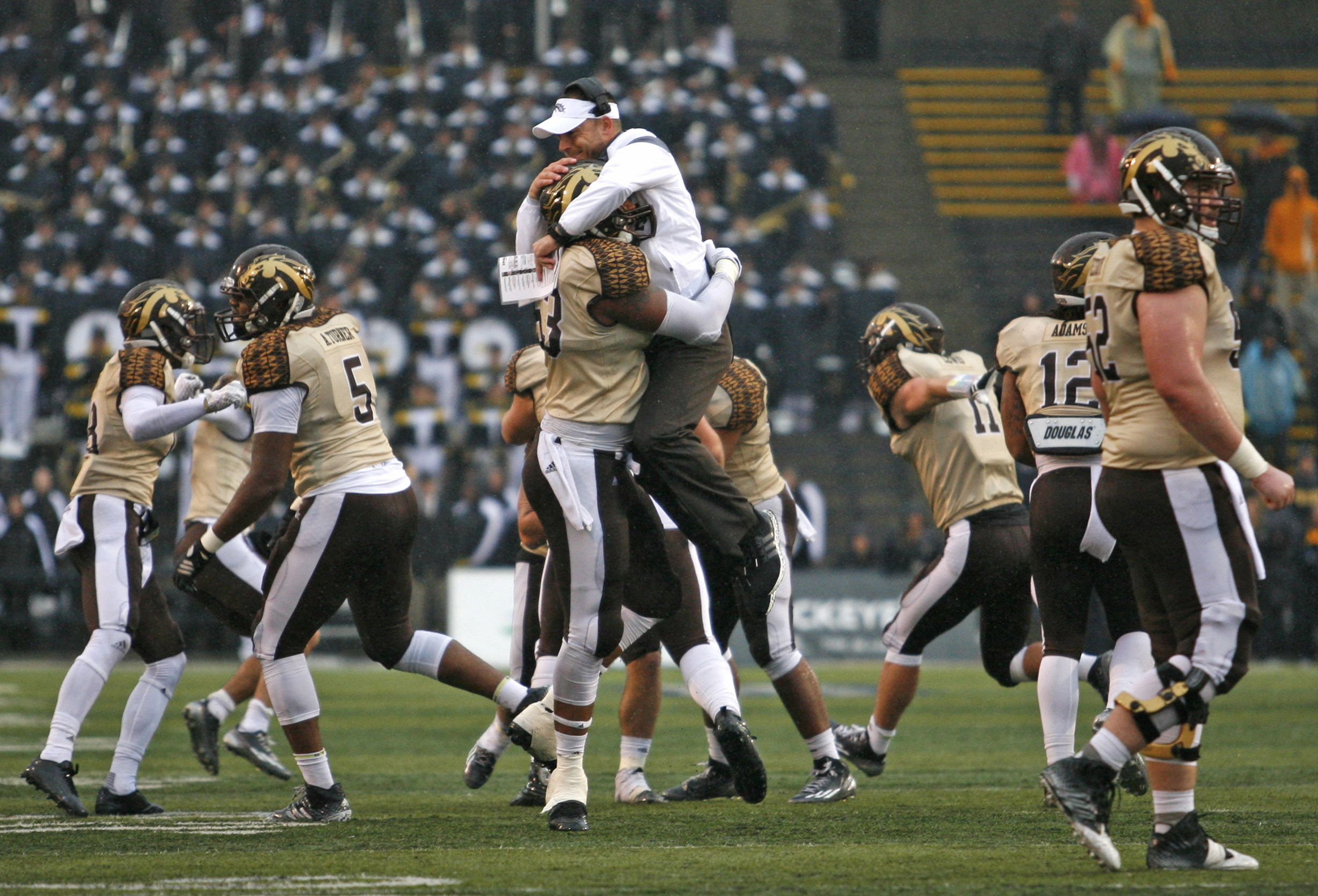 Nov 27, 2015; Toledo, OH, USA; Western Michigan Broncos head coach P.J. Fleck celebrates with his team after a play during the fourth quarter against the Toledo Rockets at Glass Bowl. Broncos win 35-30. Mandatory Credit: Raj Mehta-USA TODAY Sports